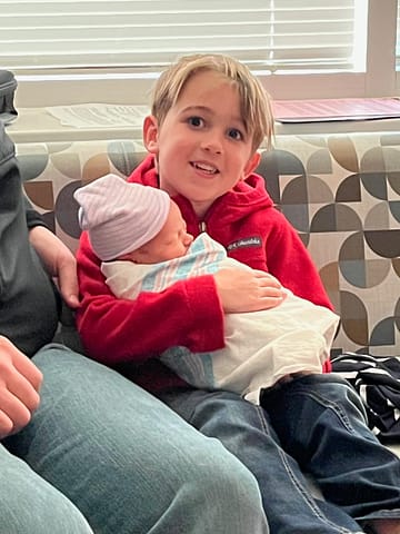 Thomas holding Michael, April 2023